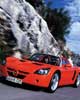 Opel, rojo deportivo en montaña