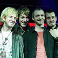 Travis trabaja en Open